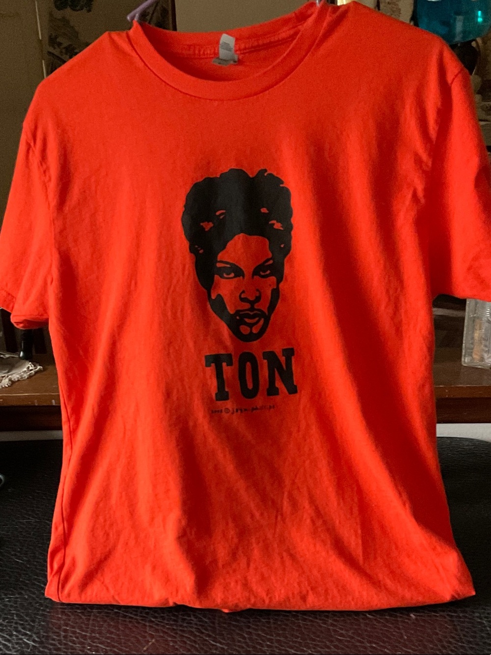 Next level Orange Short Sleeve Tee with Prince  Graphic and 'TON' Print